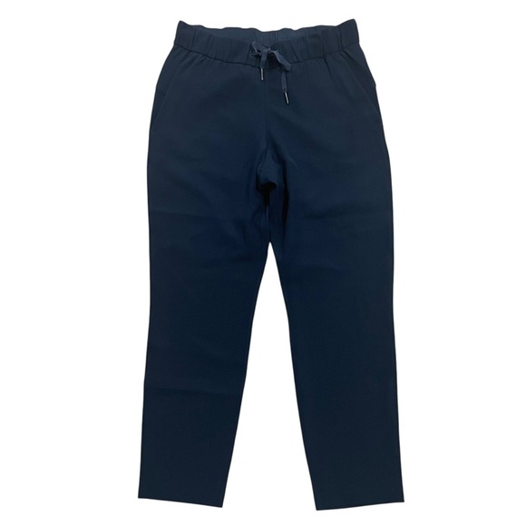 lululemon athletica Pants - Lululemon On The Fly Pant Woven 27" True Navy Drawstring Travel Pant Size 6